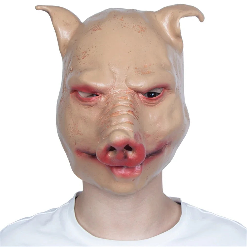Pig mask worn by a person on a white background