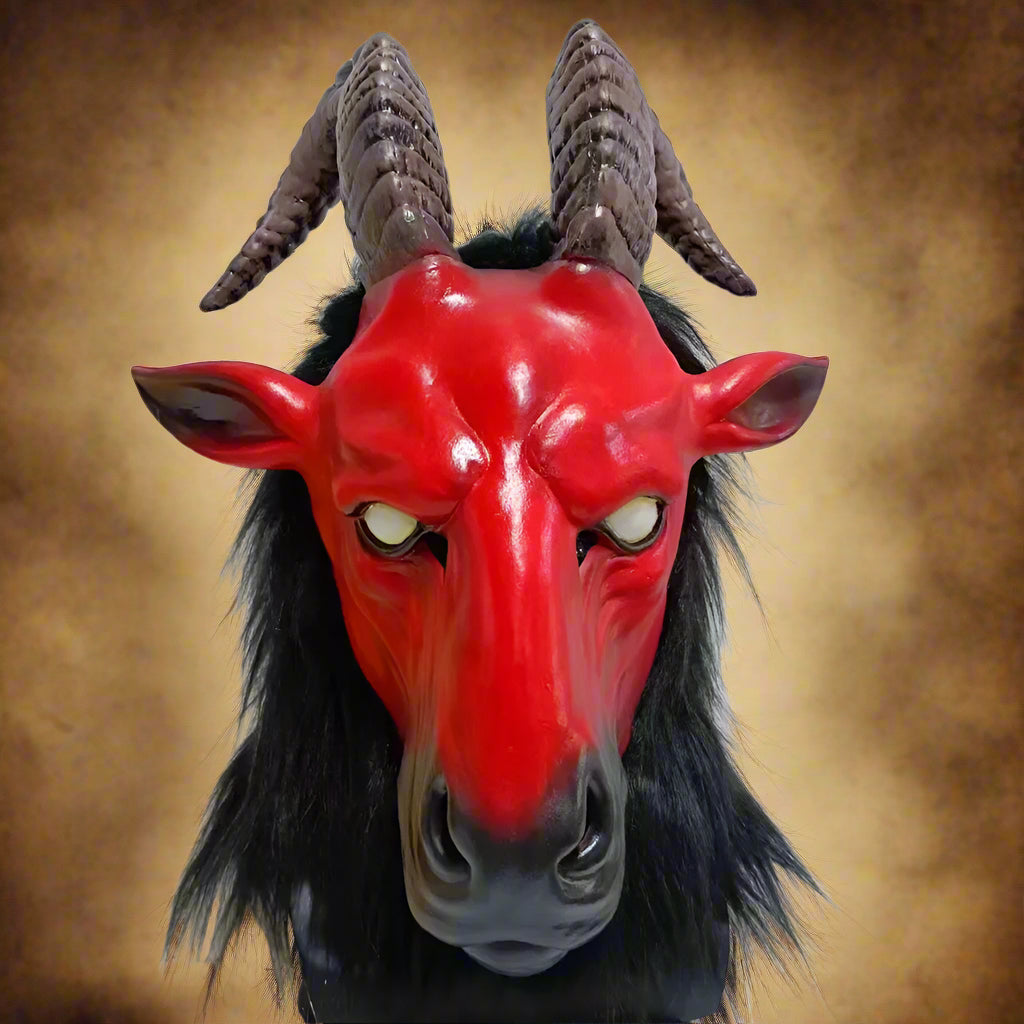 Red goat mask with black hair and large horns on a white background