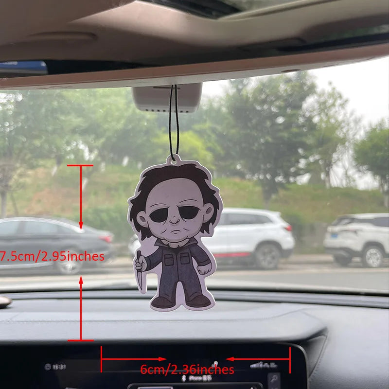 Car air freshener with measurements displayed on a car dashboard.