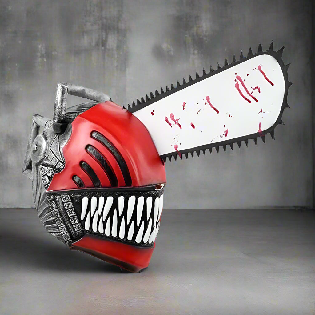 Toy chainsaw with red handle and white blade on a white background