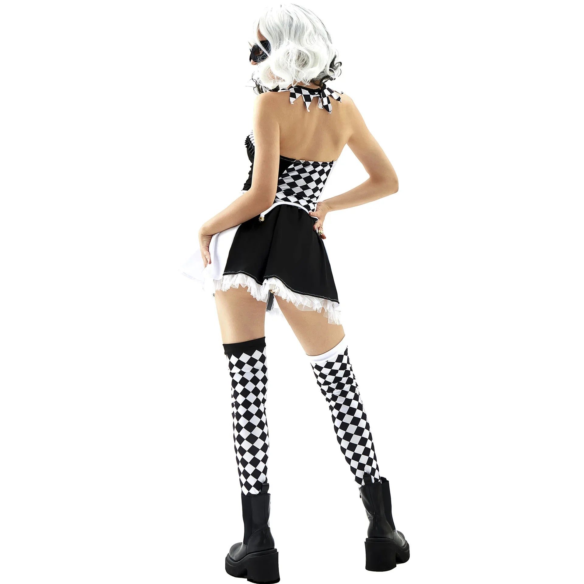 Person wearing a black and white checkered costume with a headpiece on a white background
