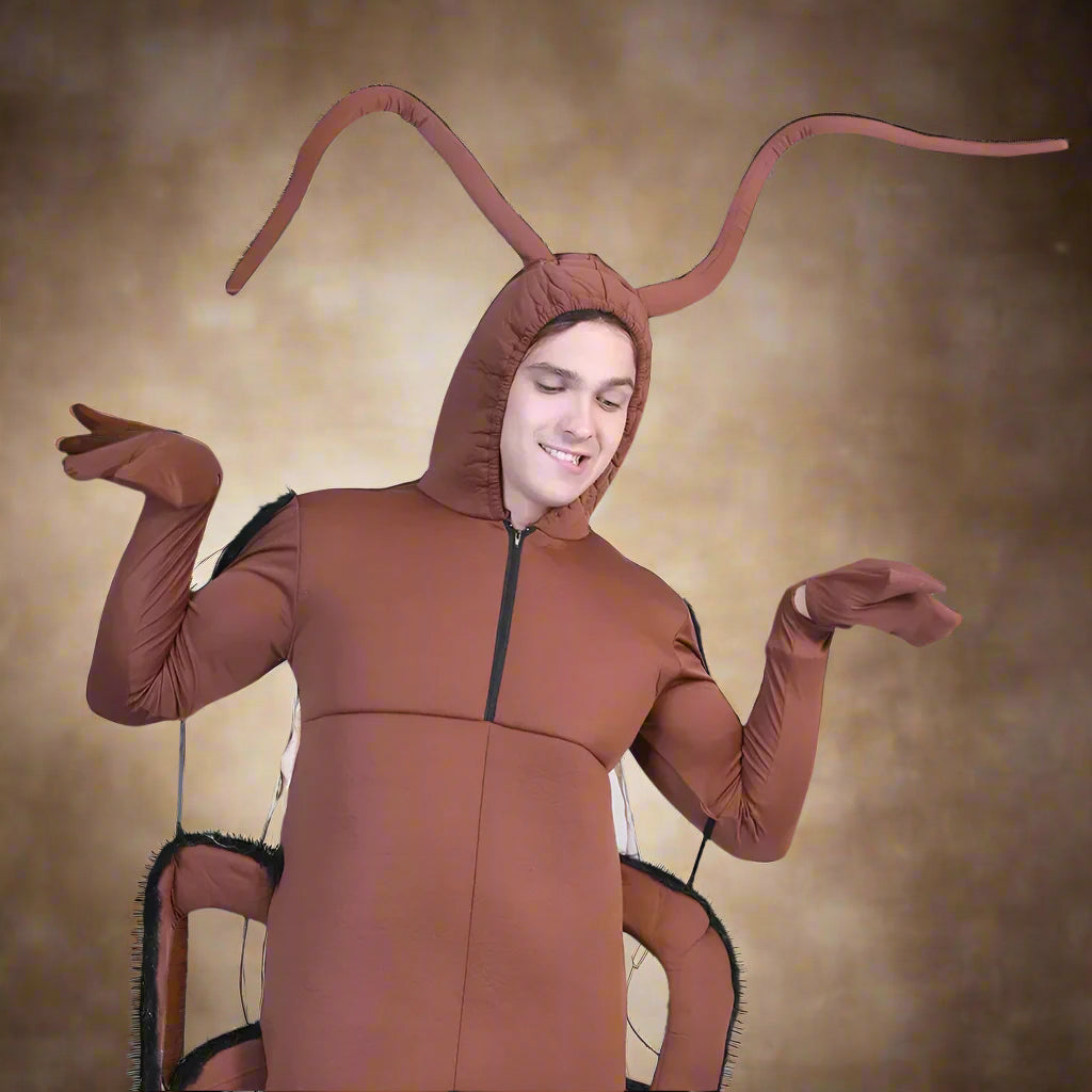 Person wearing a brown ant costume on a white background
