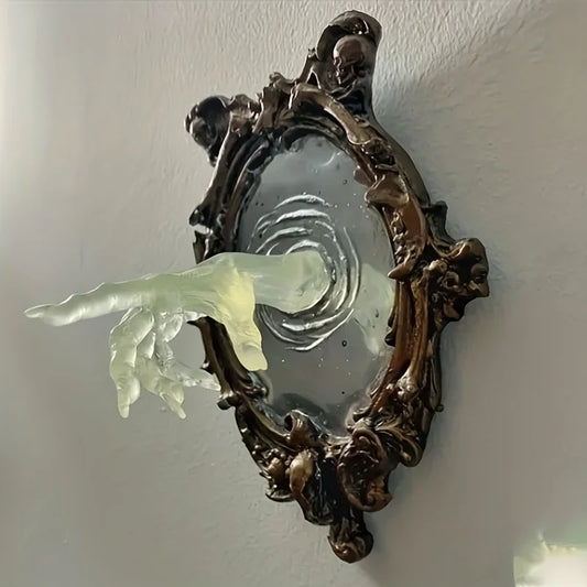 Decorative glass doorknob with intricate metal frame on a white wall