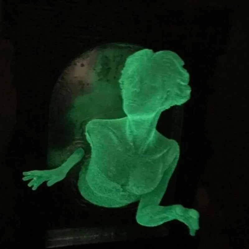 Glowing green silhouette of a person on a dark background