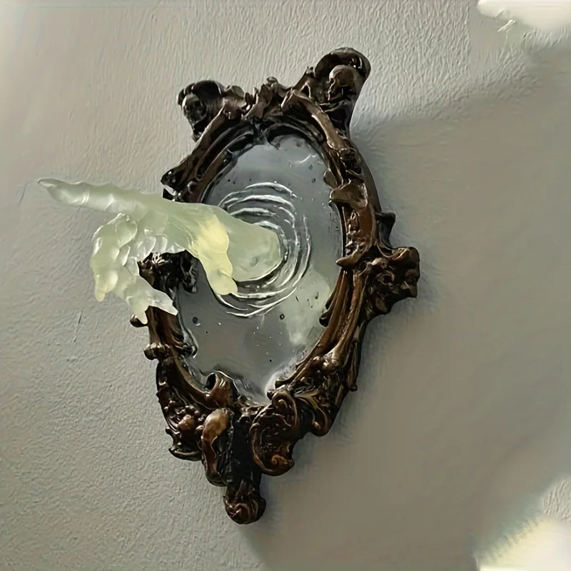 Decorative wall mirror with a floral frame on a plain wall.