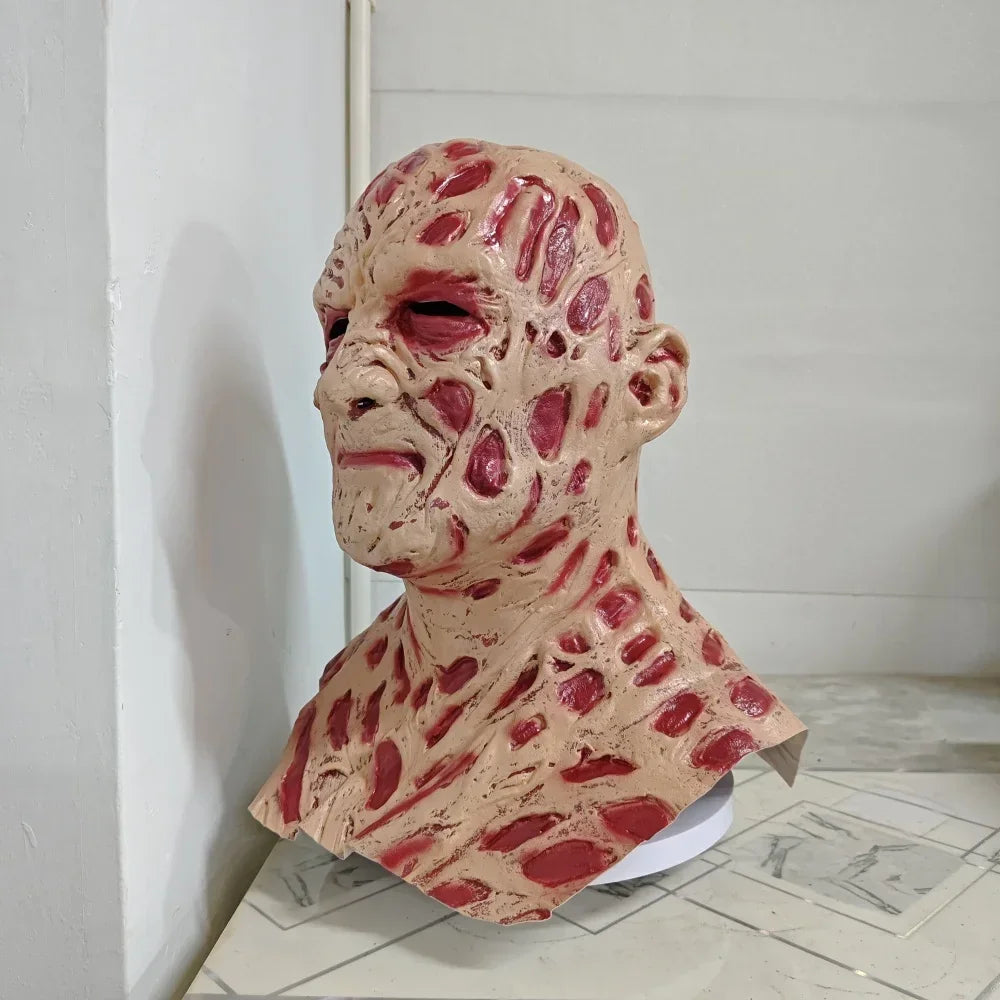 Creepy mask with red and beige texture on a white background