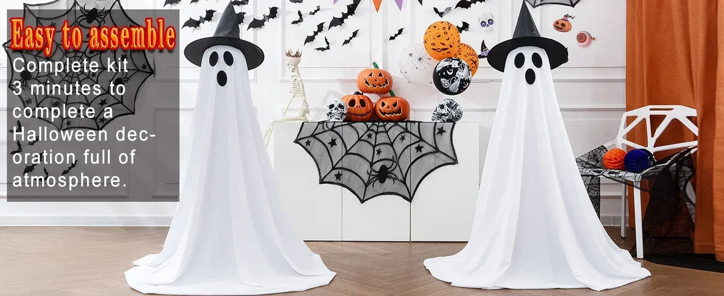Halloween decorations with ghosts, pumpkins, and spider webs on a wooden floor.