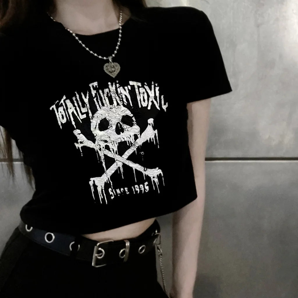 Person wearing a black t-shirt with a skull and crossbones design and text.