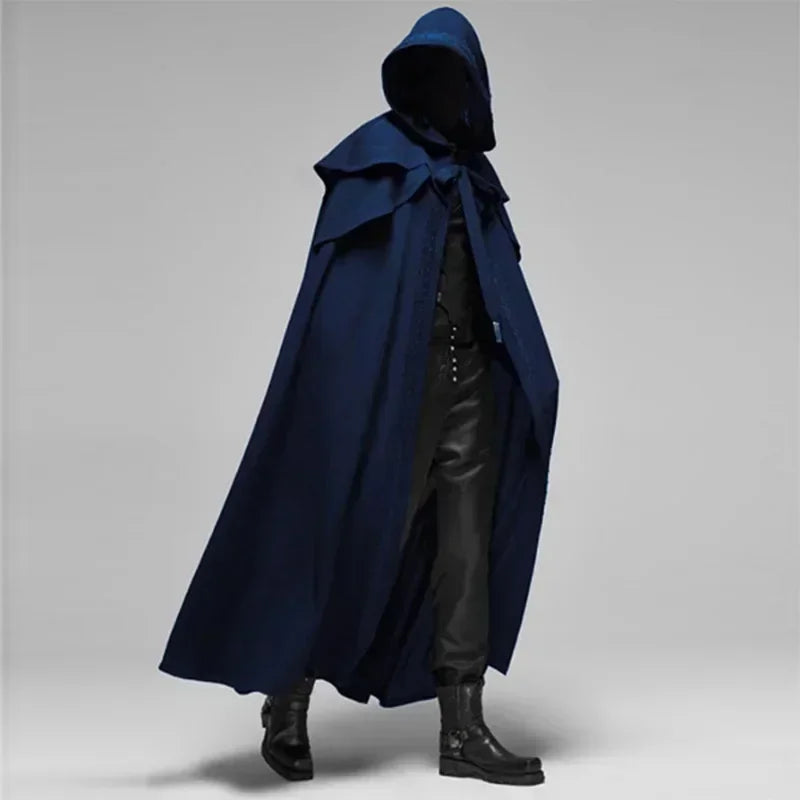 Person wearing a blue hooded cloak on a gray background