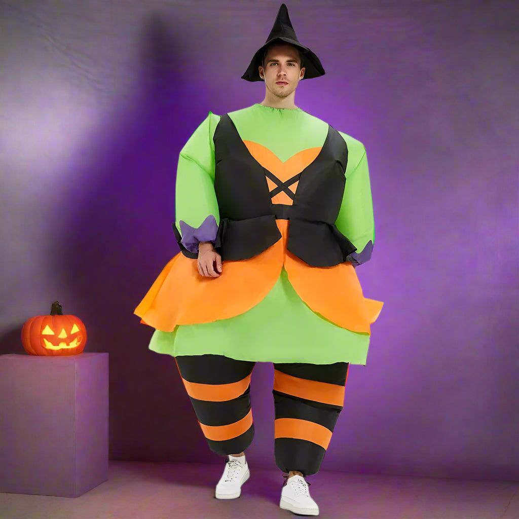 Person wearing a colorful Halloween costume with green, orange, and black outfit on a white background