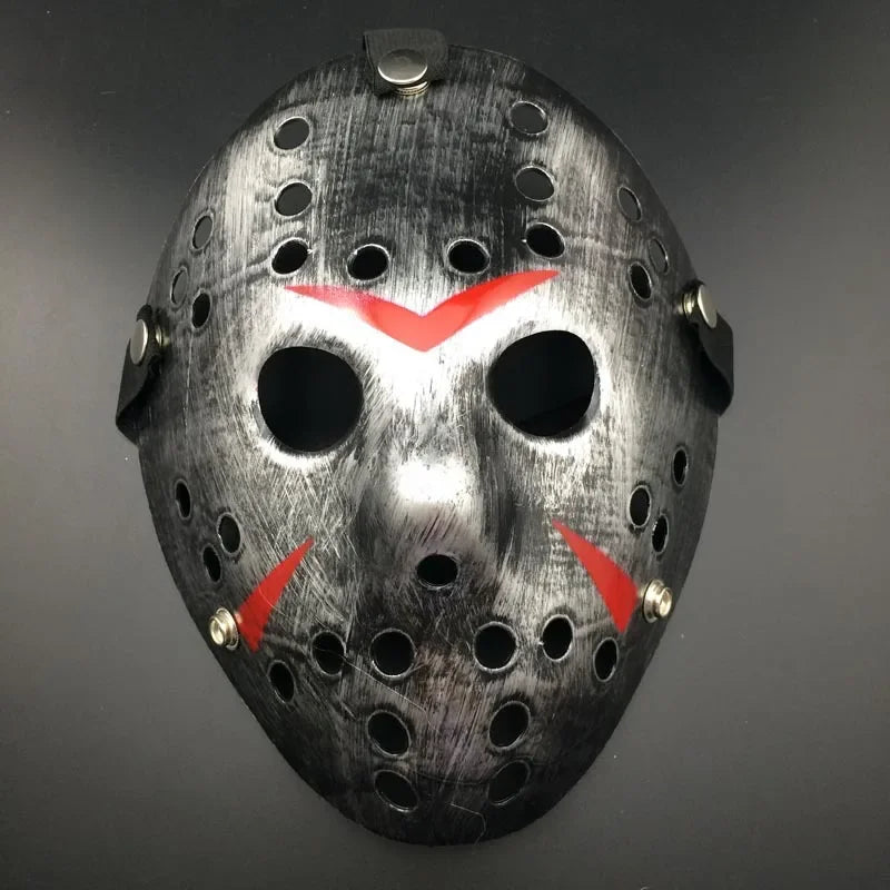 Black mask with red accents on a gray background