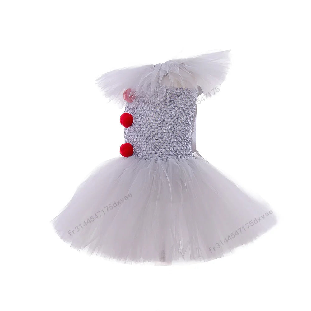 Children's dress with red polka dots and tulle skirt on a white background