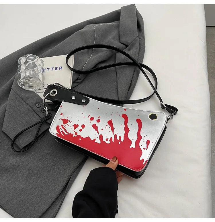 Handbag with red and white design on a gray surface