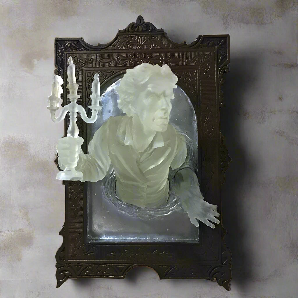 Decorative plaque with a bust of a man holding a candle in an ornate wooden frame.