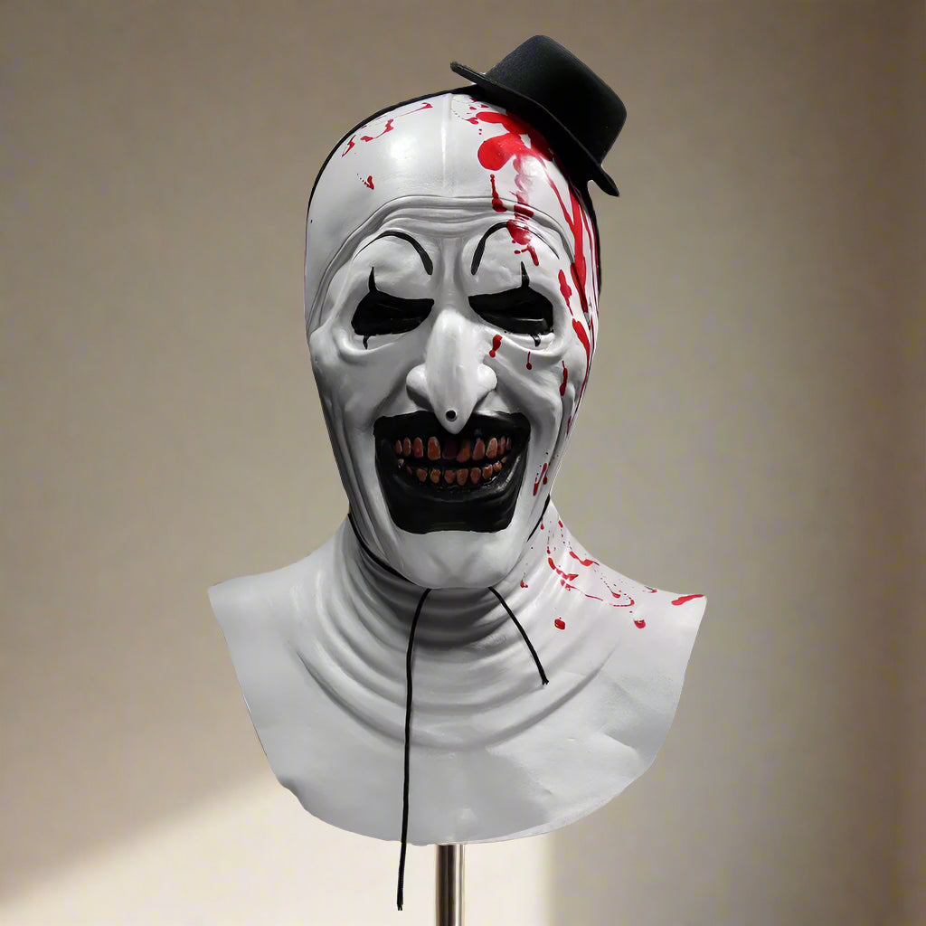 Horror-themed mask with red accents on a white background