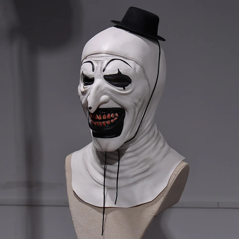 White mask with black top hat on a mannequin head against a gray background