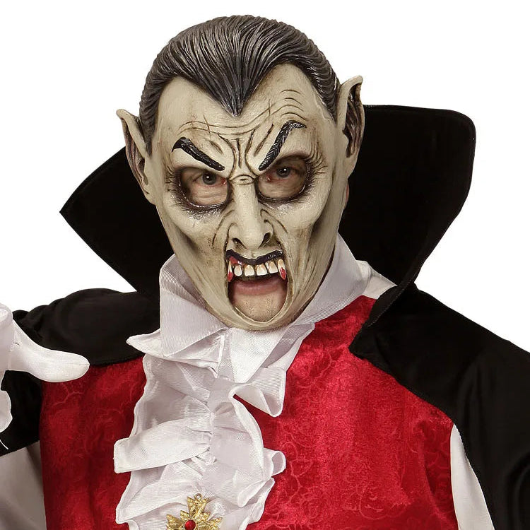 Person wearing a vampire costume with a red shirt, white collar, and black cape.