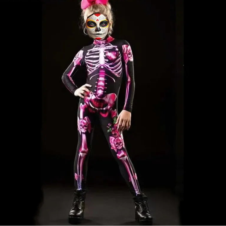 Child wearing a pink skeleton costume with floral designs on a black background