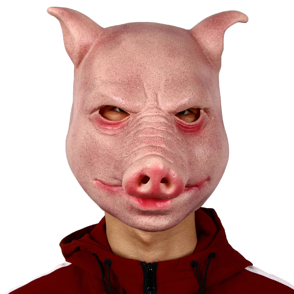 Person wearing a pig mask with a red hoodie on a white background