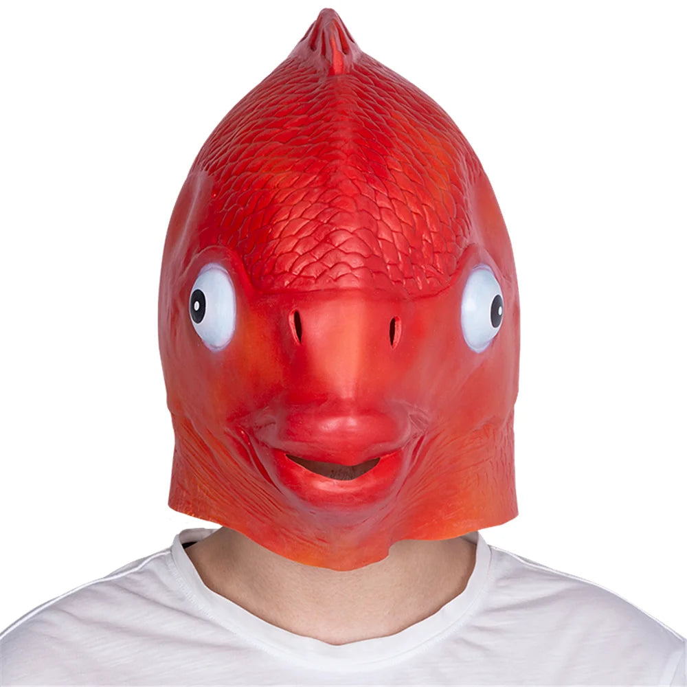 Red fish-shaped mask worn by a person on a white background