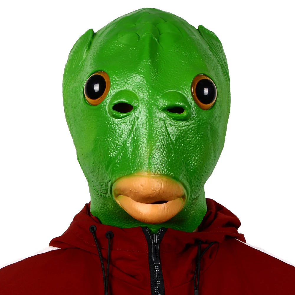 Person wearing a green frog mask with a red hoodie on a white background