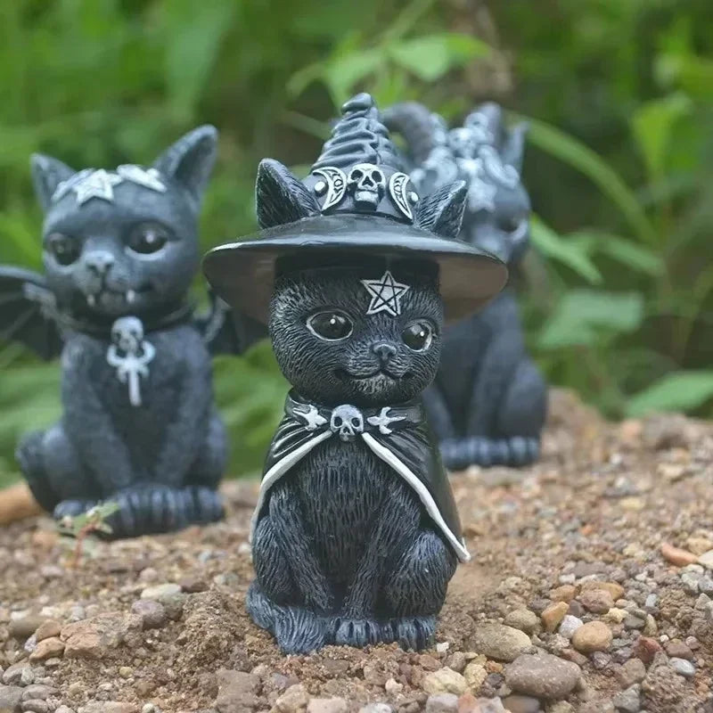 Gothic-style cat figurine with a witch hat and pentacle symbol on a natural background