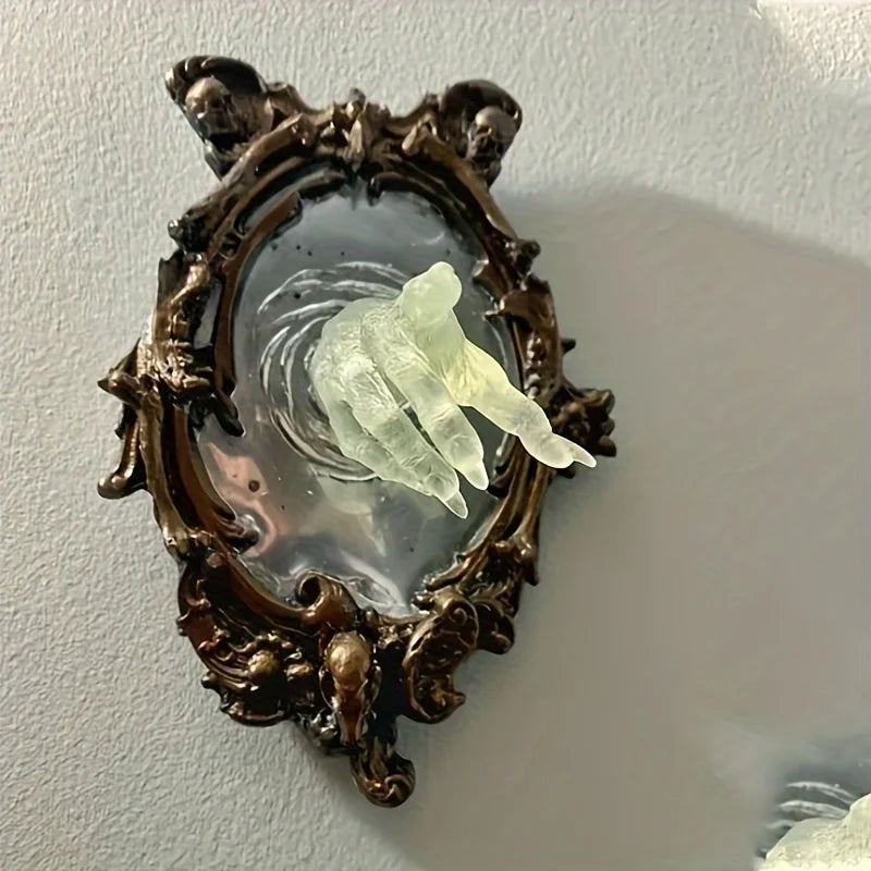 Decorative mirror with ornate frame and a ghostly figure inside on a plain wall.