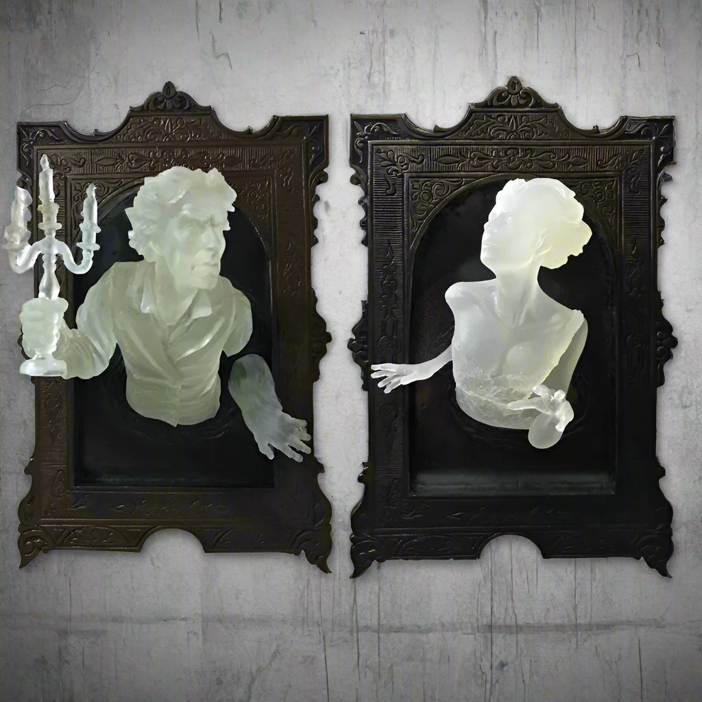 Two decorative wall art pieces with classical busts in ornate frames on a white background.