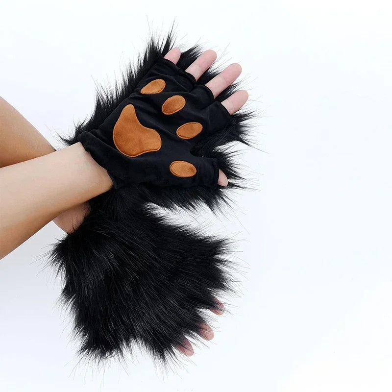 Black fur gloves with brown pads on a white background