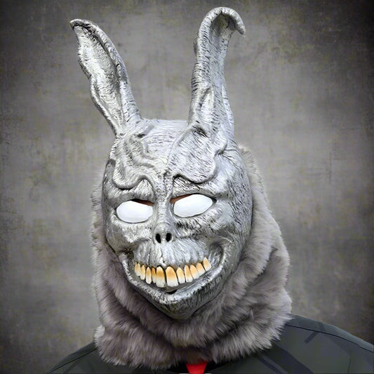 Person wearing a detailed rabbit mask with fur texture outdoors