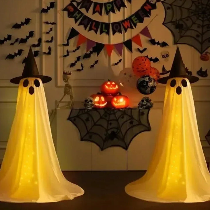 Halloween-themed room with glowing ghosts, pumpkins, and decorations.