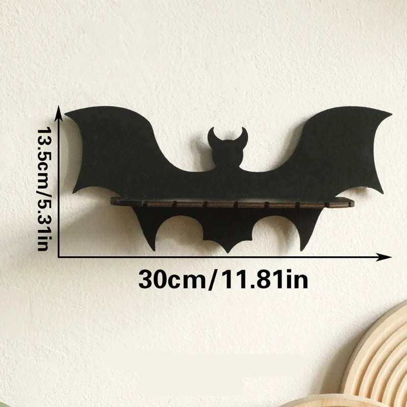 Black bat-shaped shelf with measurements on a beige background