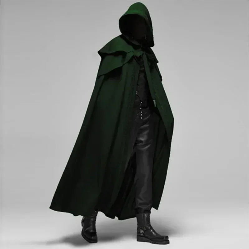 Person wearing a long green hooded cloak on a gray background