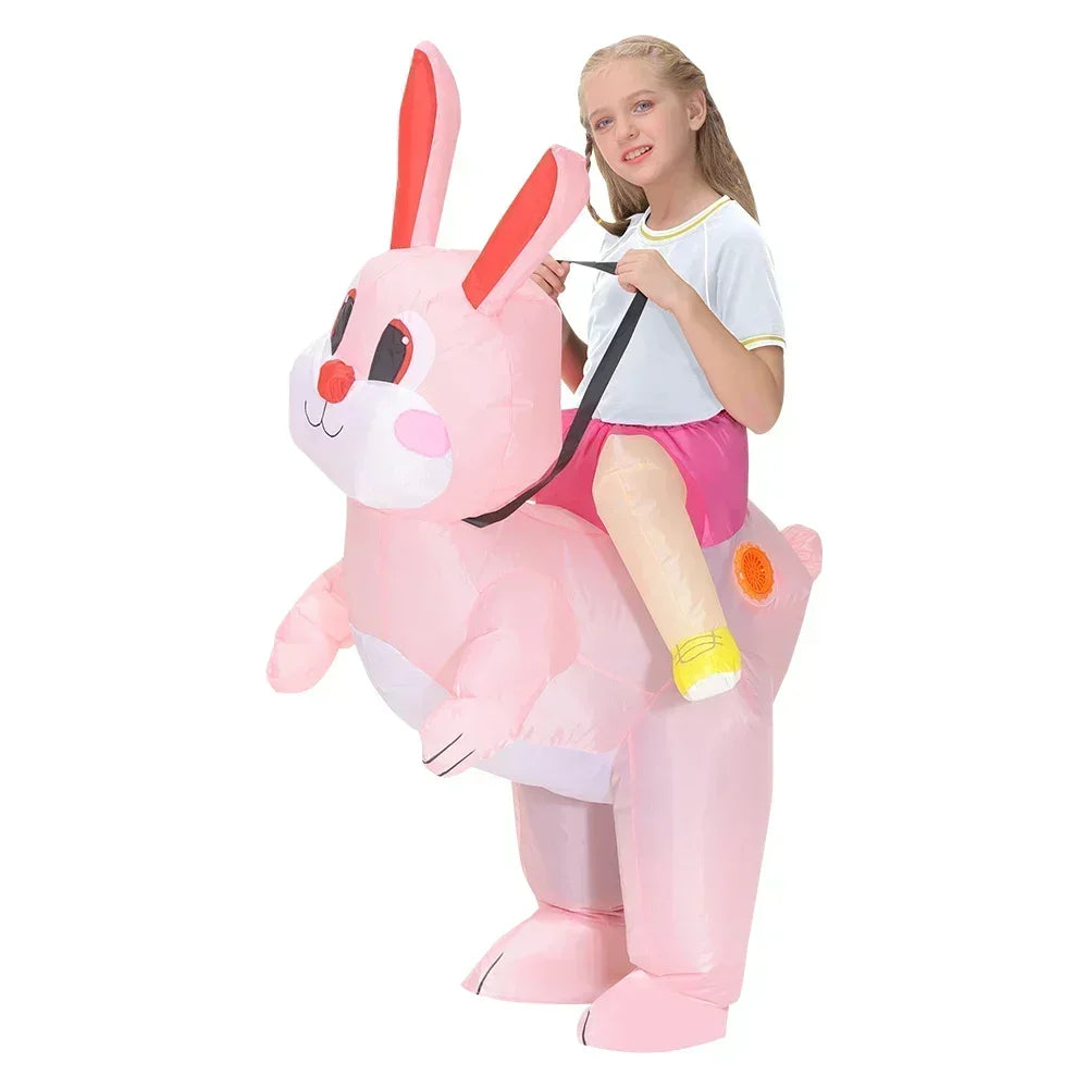 Child in a pink inflatable bunny costume on a white background