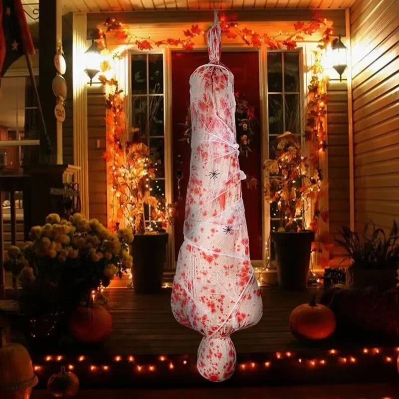 Decorative Halloween tree with blood splatter design on a porch decorated for the holiday.