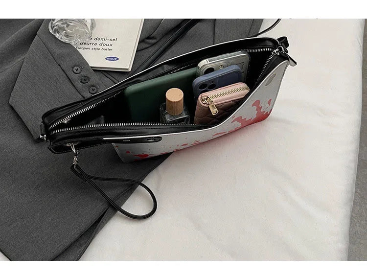 Small pouch with compartments on a gray surface