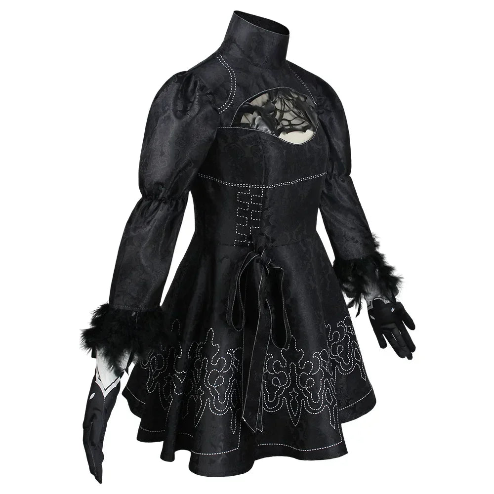 Black gothic-style dress with intricate detailing on a white background