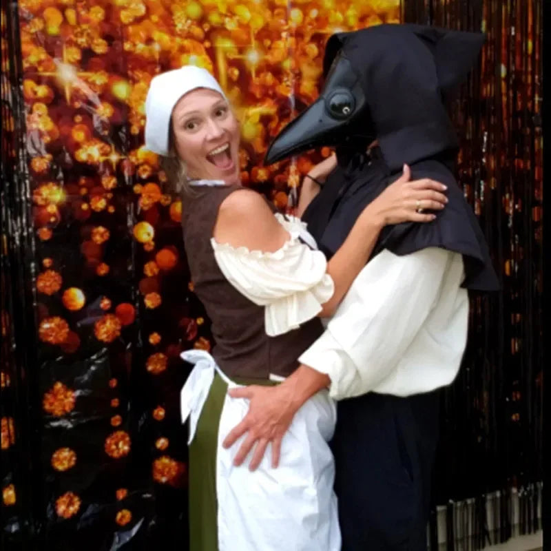Two people in costumes, one resembling a plague doctor and the other in a medieval outfit, against a festive background.