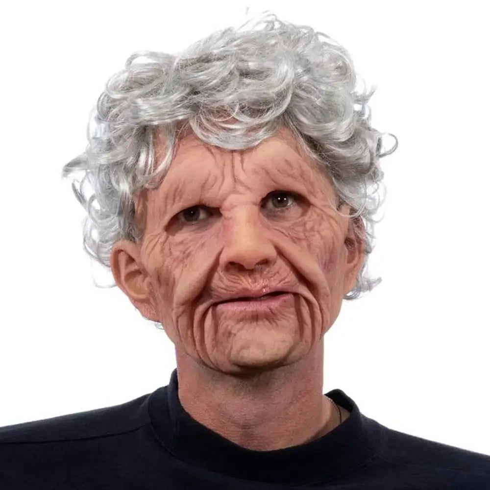 Older person wearing a gray wig on a white background