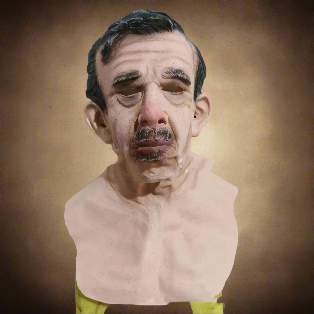 Bust of a man with a clear face mask on a white wall background