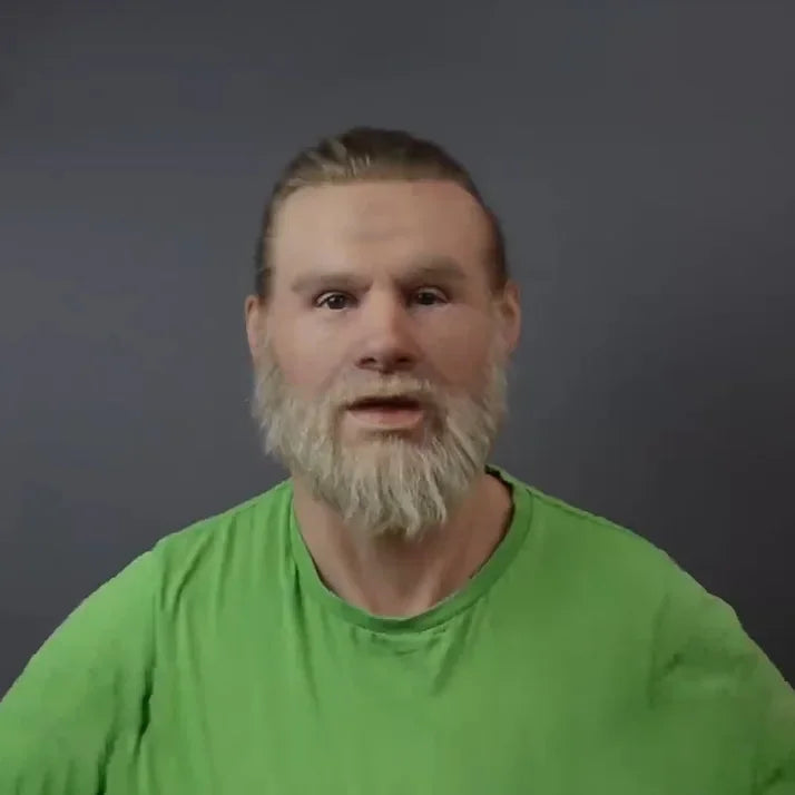 Man with a beard wearing a green shirt against a dark background