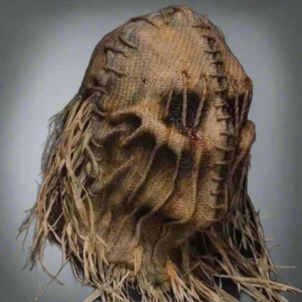 Scarecrow head with straw body on a black background