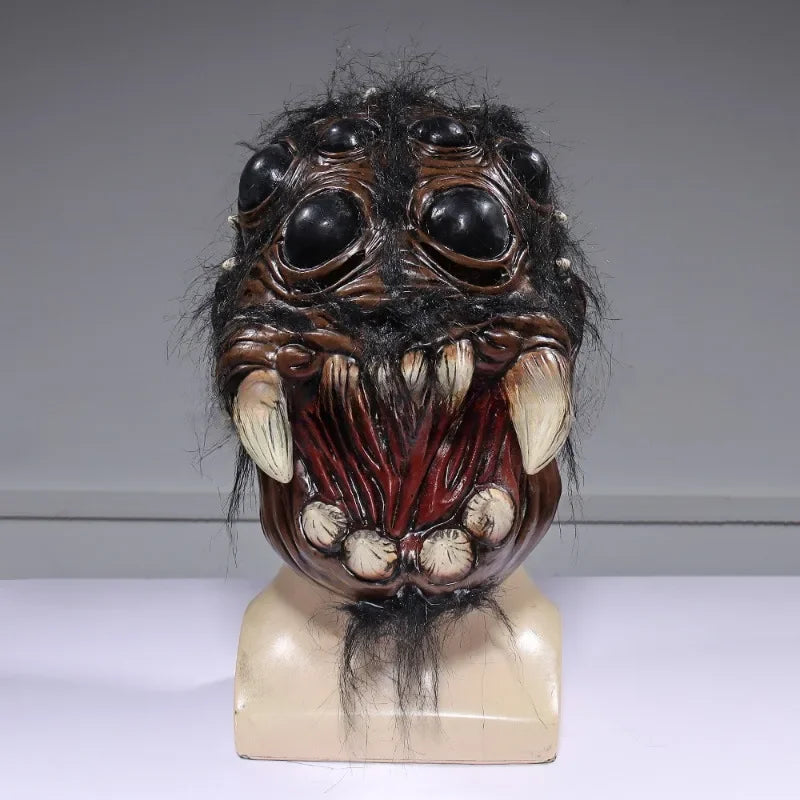 Creepy mask with large eyes and teeth on a gray background