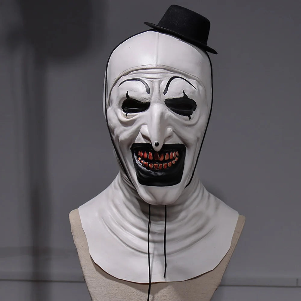 White mask with black accents on a mannequin head against a gray background