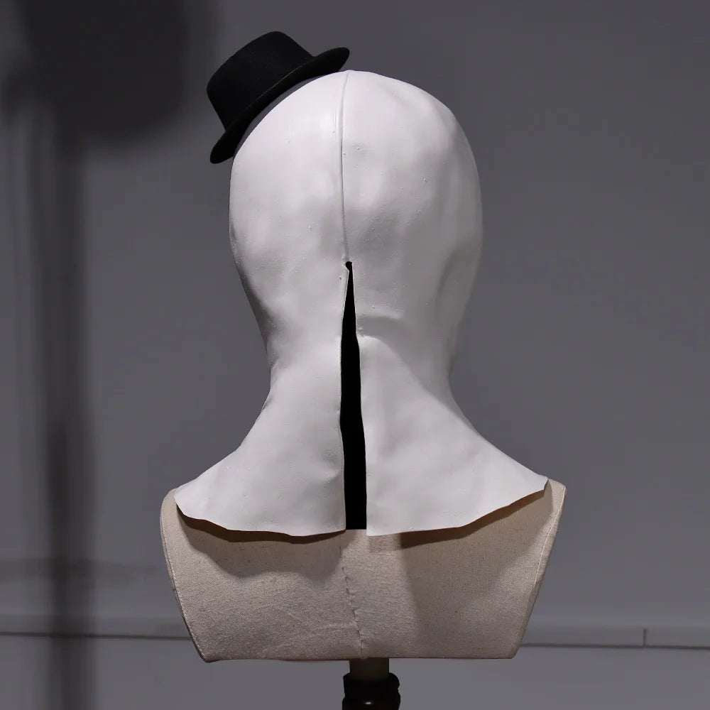 Mannequin head with a white hood and black hat on a gray background