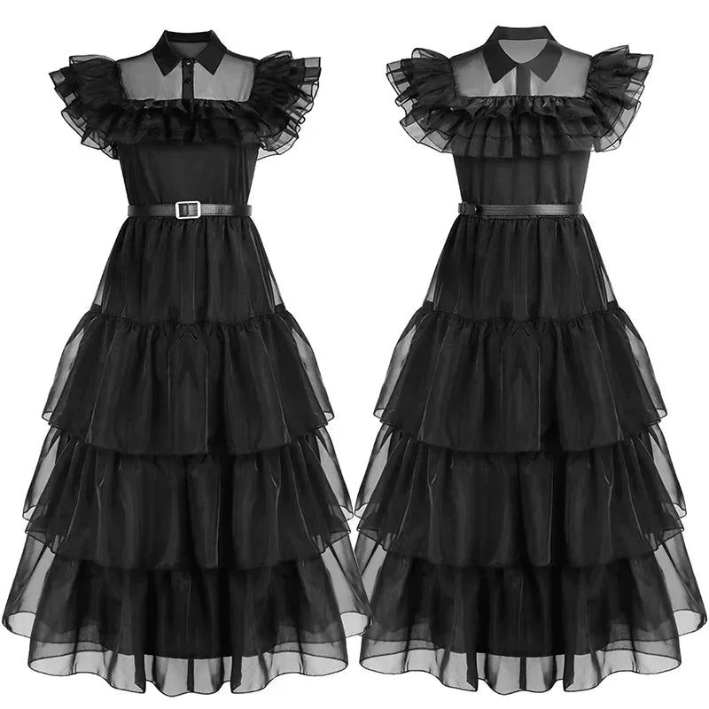 Black tiered dress with sheer top on a white background