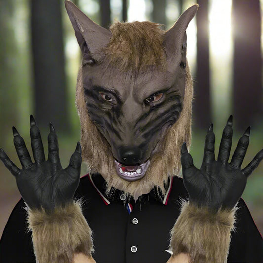 Person wearing a wolf mask and fur-lined gloves on a plain background