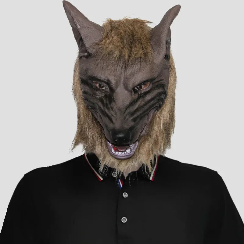 Person wearing a wolf mask with a black shirt featuring a logo on a white background